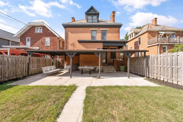 rear view of property with an outdoor living space, a patio, and a yard