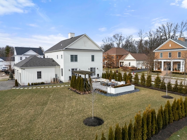 rear view of property with a pergola, cooling unit, and a yard