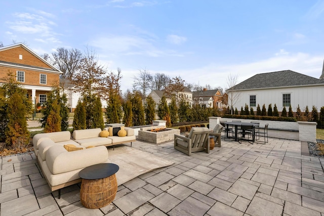 view of patio / terrace featuring an outdoor living space with a fire pit