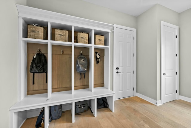 mudroom with wood-type flooring