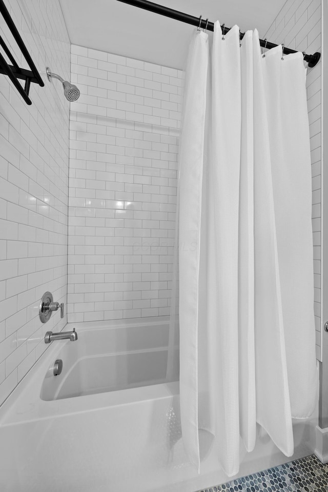 bathroom with shower / bathtub combination with curtain