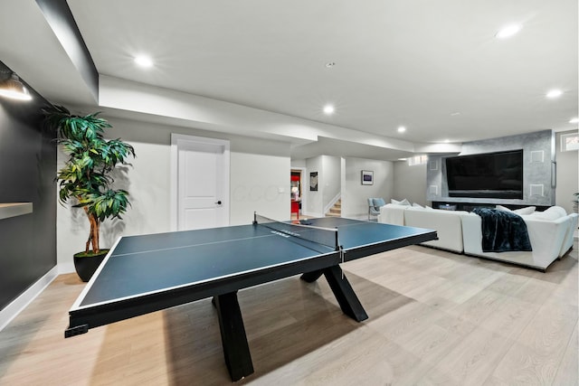 recreation room featuring light hardwood / wood-style floors