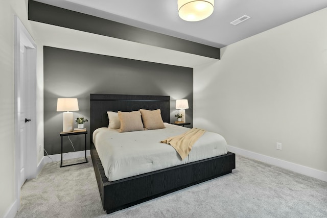 carpeted bedroom featuring beam ceiling