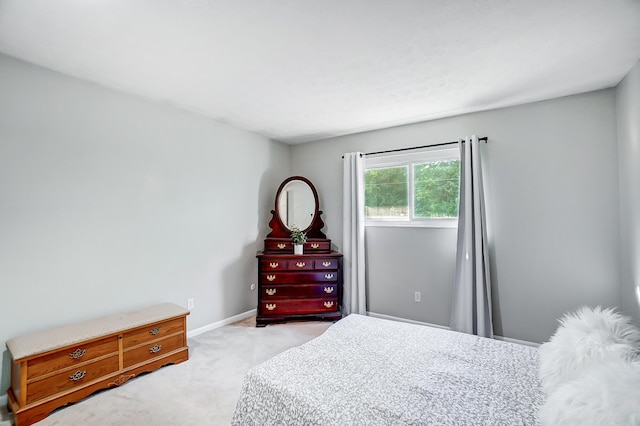 bedroom featuring light colored carpet