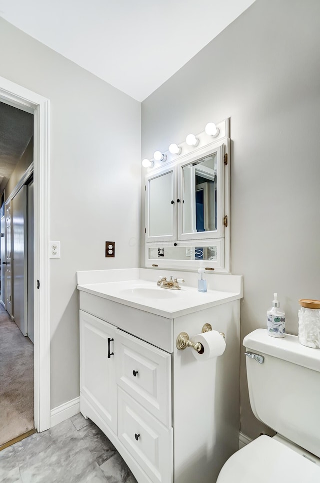 bathroom with vanity and toilet