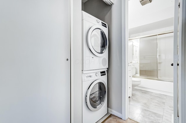 laundry room with stacked washer and clothes dryer