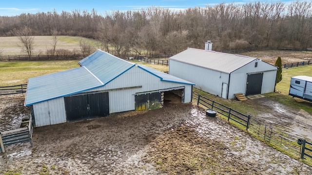 view of outbuilding with a rural view