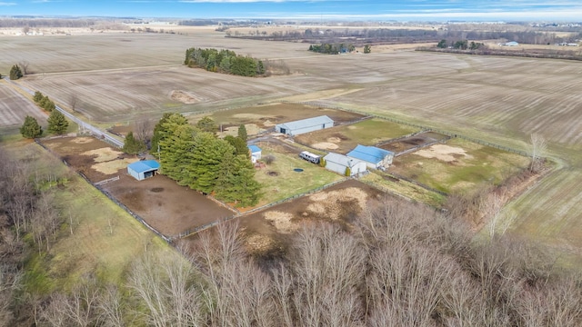 birds eye view of property with a rural view