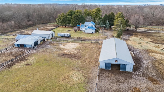 birds eye view of property with a rural view