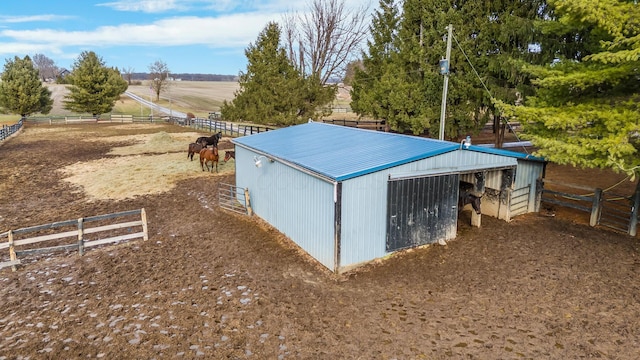 view of outdoor structure with a rural view