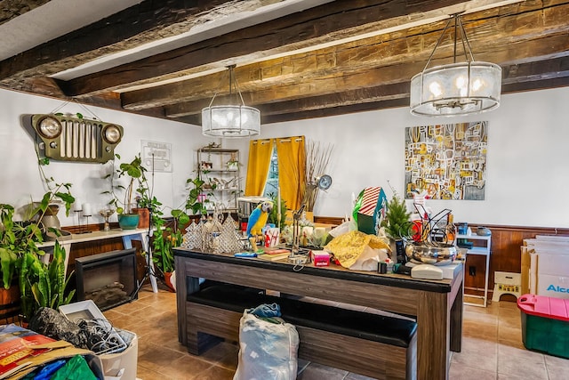 miscellaneous room featuring beamed ceiling and tile patterned flooring