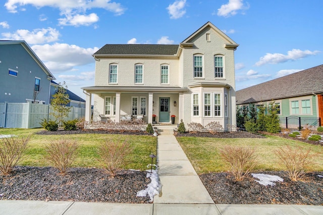 view of front of home featuring a front lawn and a porch