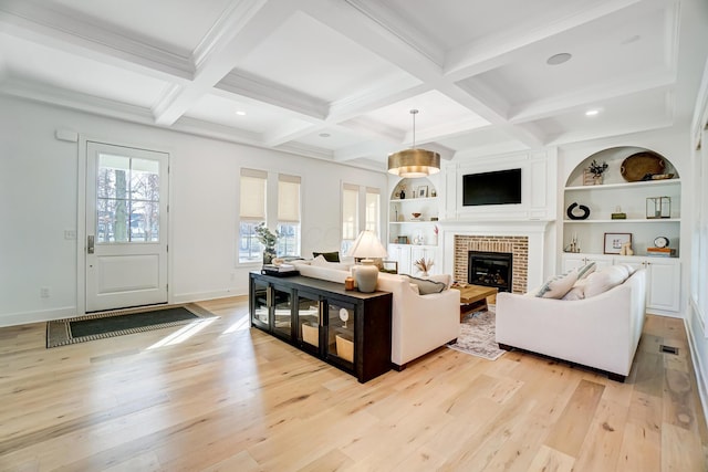 living room with coffered ceiling, beam ceiling, and light hardwood / wood-style floors