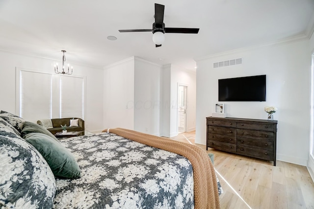 bedroom featuring ornamental molding, ceiling fan with notable chandelier, and light hardwood / wood-style floors