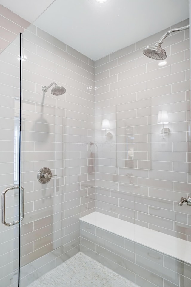 bathroom with a shower with shower door