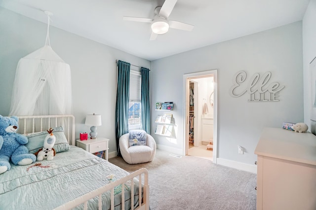 bedroom featuring ensuite bath, ceiling fan, and carpet flooring