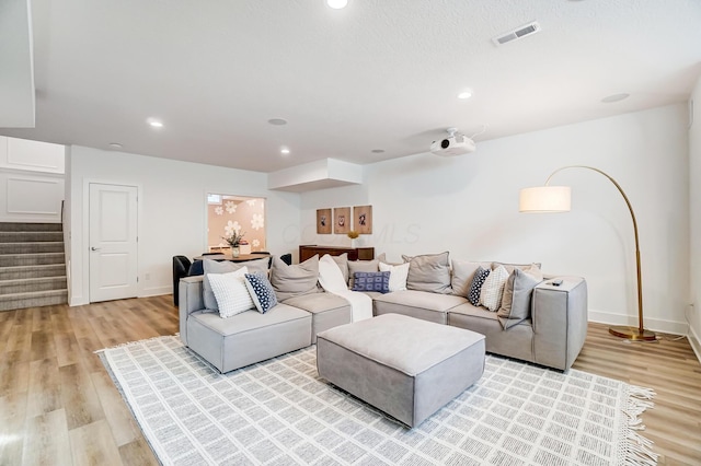 living room with light hardwood / wood-style flooring