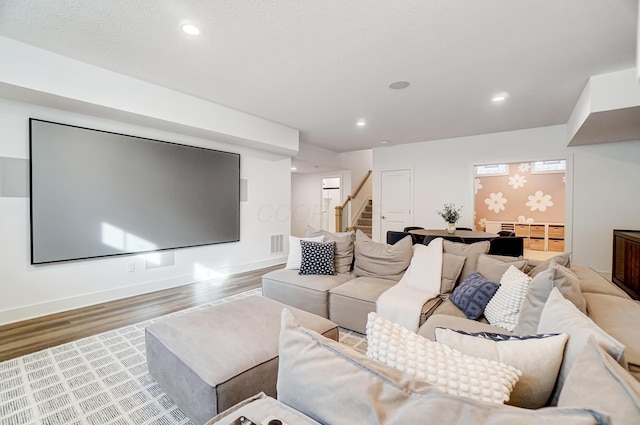 cinema room featuring wood-type flooring