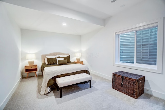 bedroom featuring light colored carpet