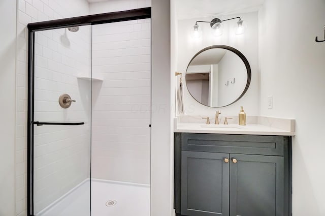 bathroom with vanity and a shower with door