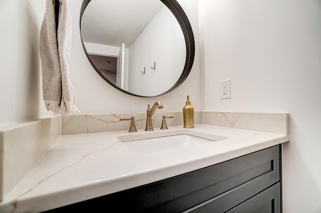 bathroom featuring vanity and a textured ceiling