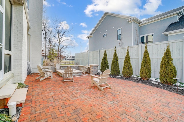 view of patio / terrace with an outdoor fire pit