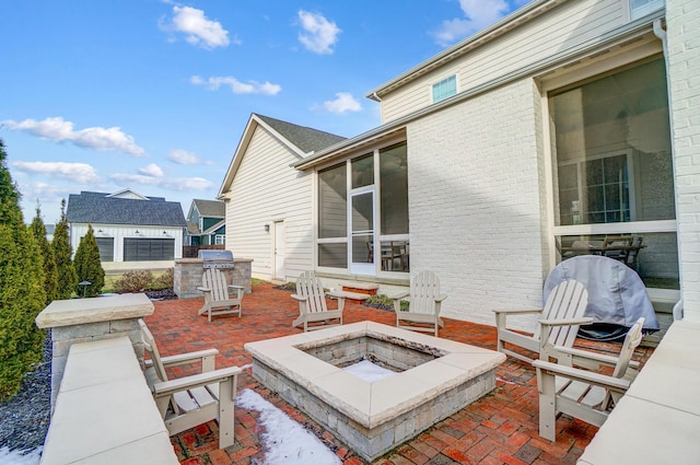 view of patio / terrace with an outdoor fire pit