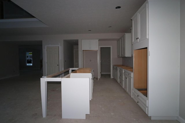 kitchen featuring white cabinets and a kitchen island