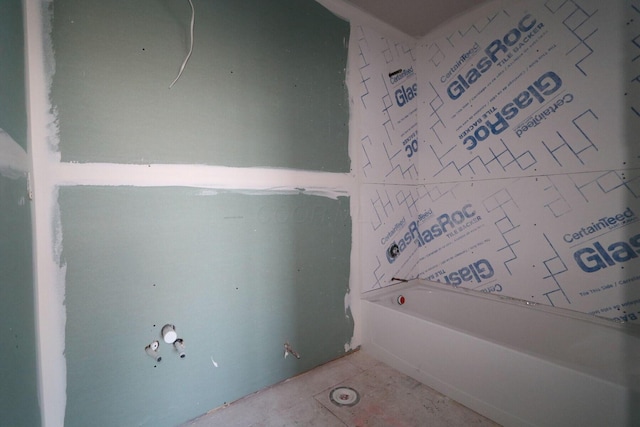 bathroom featuring a washtub