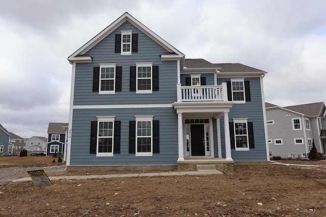 view of front of home with a balcony