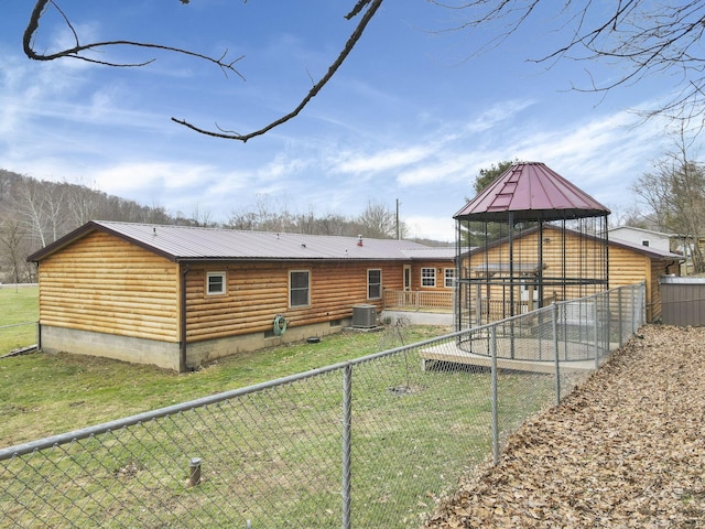 rear view of property featuring cooling unit