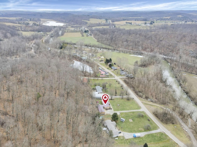 birds eye view of property with a rural view