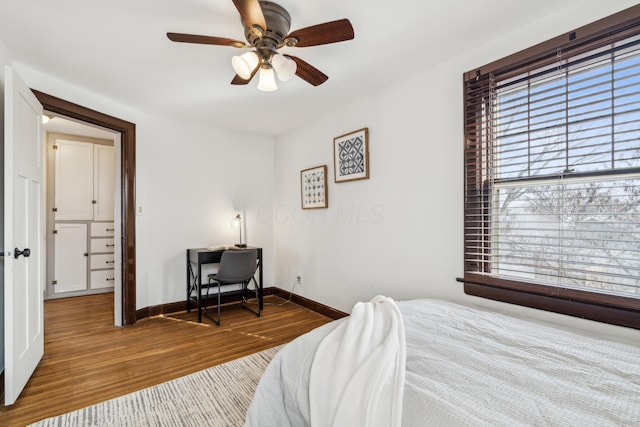 bedroom with ceiling fan and hardwood / wood-style floors