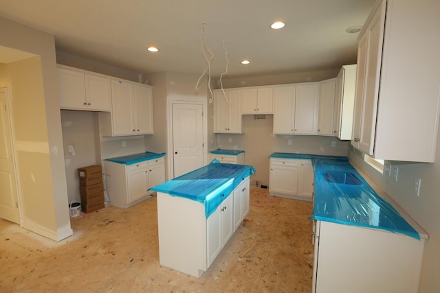 kitchen featuring a center island and white cabinets