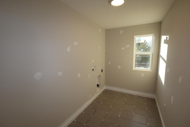 laundry area with washer hookup, electric dryer hookup, laundry area, baseboards, and tile patterned floors