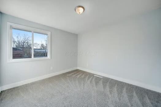 unfurnished room featuring carpet floors