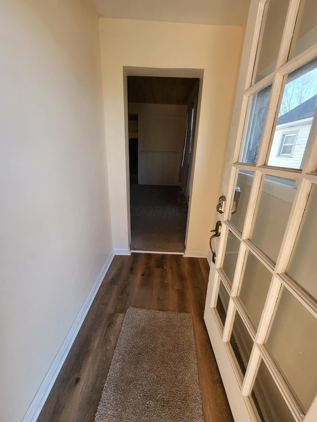 corridor featuring dark wood-type flooring