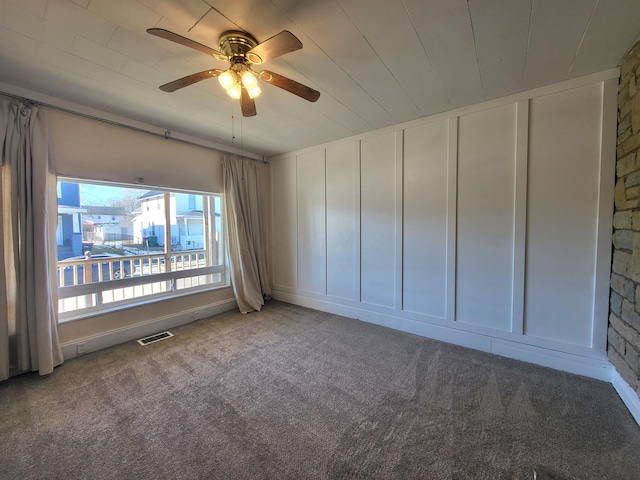 unfurnished room featuring carpet and ceiling fan