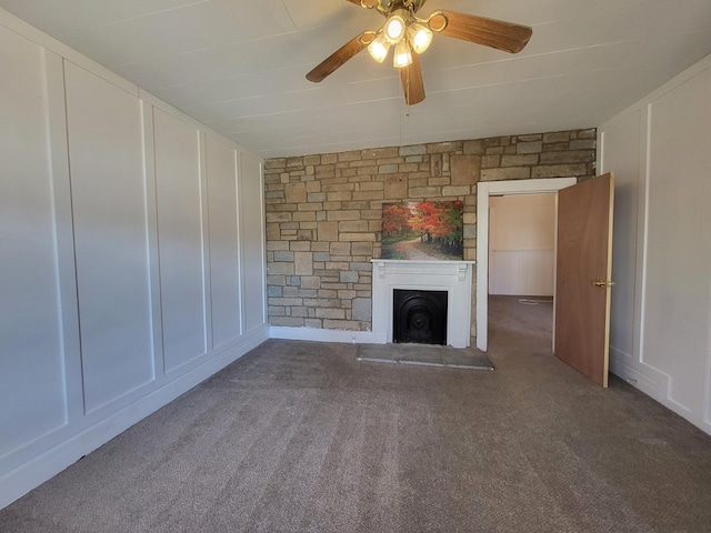 unfurnished living room featuring ceiling fan and carpet flooring