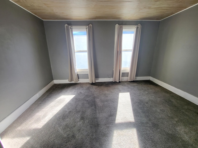 empty room with plenty of natural light and carpet floors