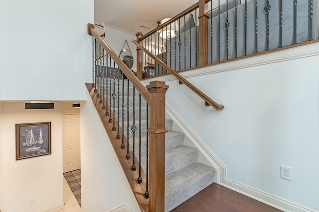 stairway featuring wood-type flooring