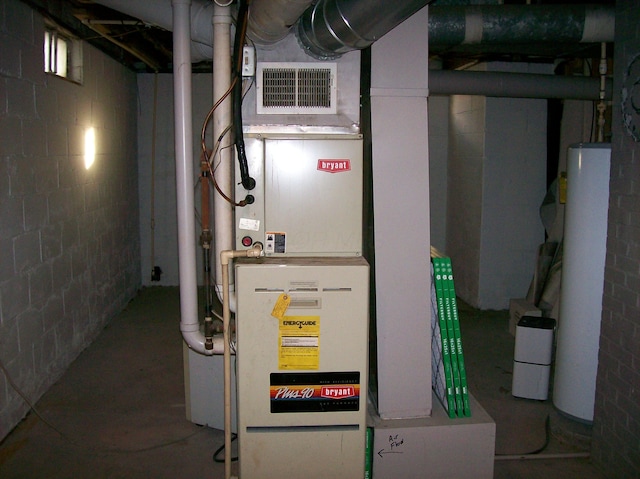 utilities with heating unit and gas water heater