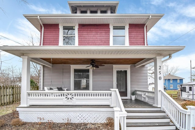 view of front of home featuring ceiling fan and a porch