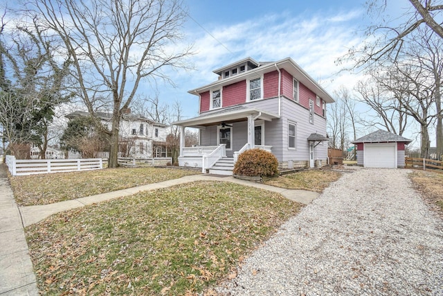 view of front of property with a garage, an outdoor structure, a front lawn, and covered porch