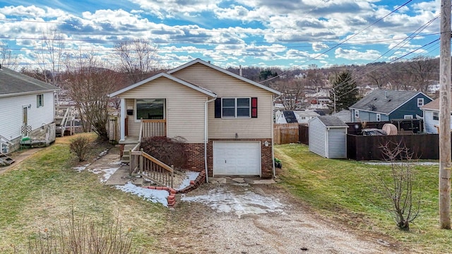 back of property with a shed, a yard, and a garage