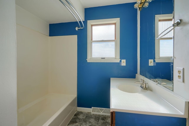 bathroom with vanity and shower / tub combination