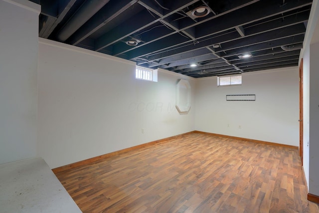 basement featuring hardwood / wood-style floors