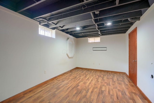 basement with wood-type flooring