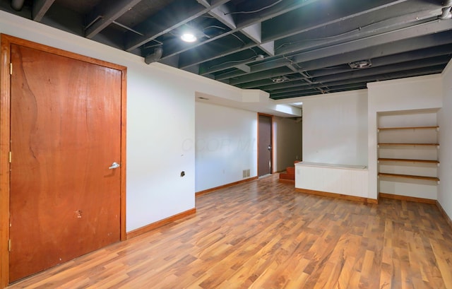 basement featuring hardwood / wood-style flooring