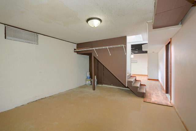 basement with a textured ceiling